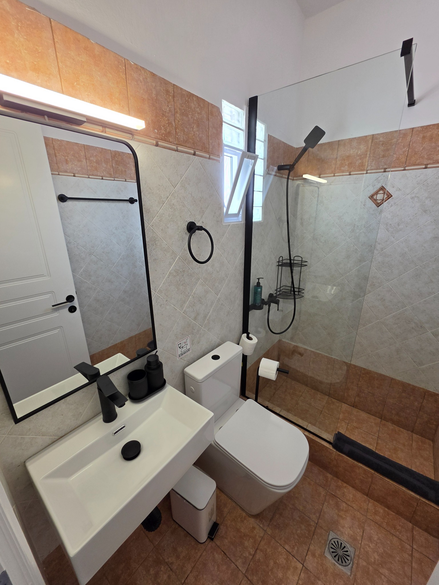 Room with double bed and balcony