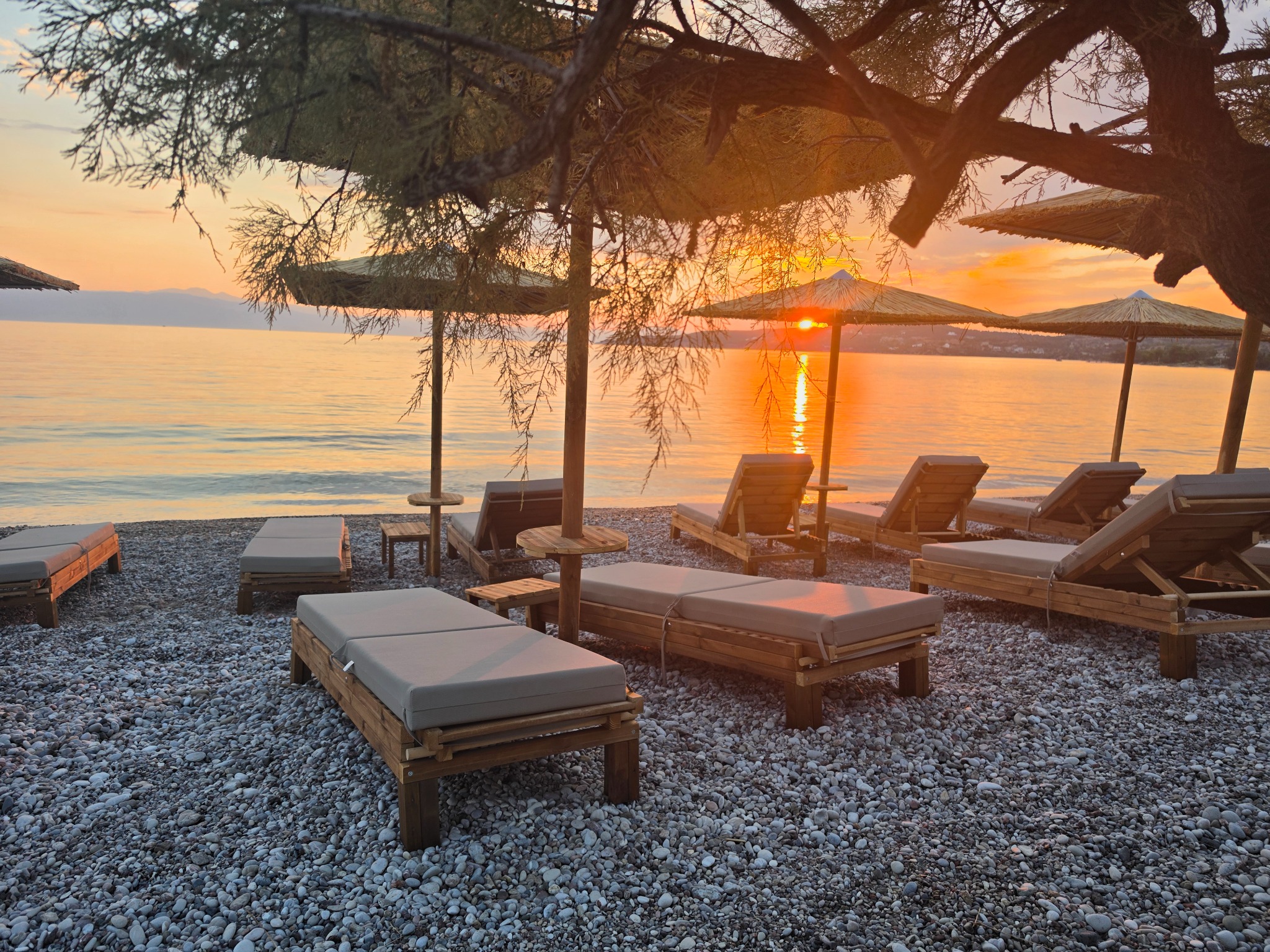 Magenta Beach sunset and sunbeds